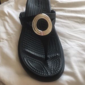 Black with painted toes on the sandal Crocs
